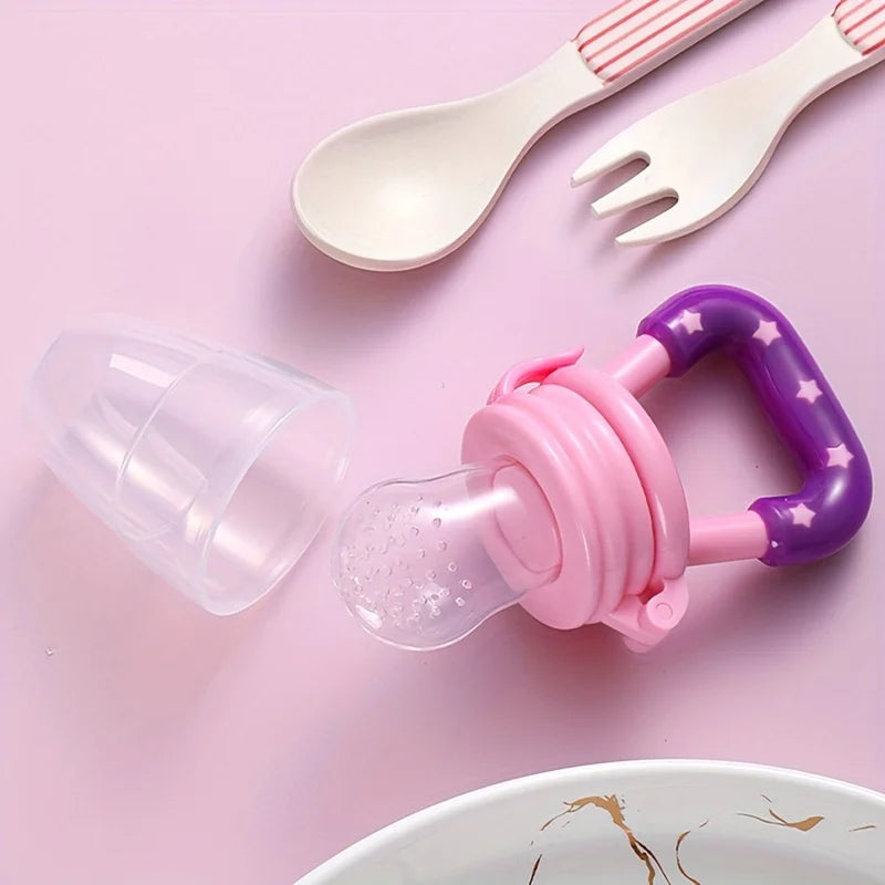 Baby silicone feeder pacifier with purple star handle, spoon and fork on pink background