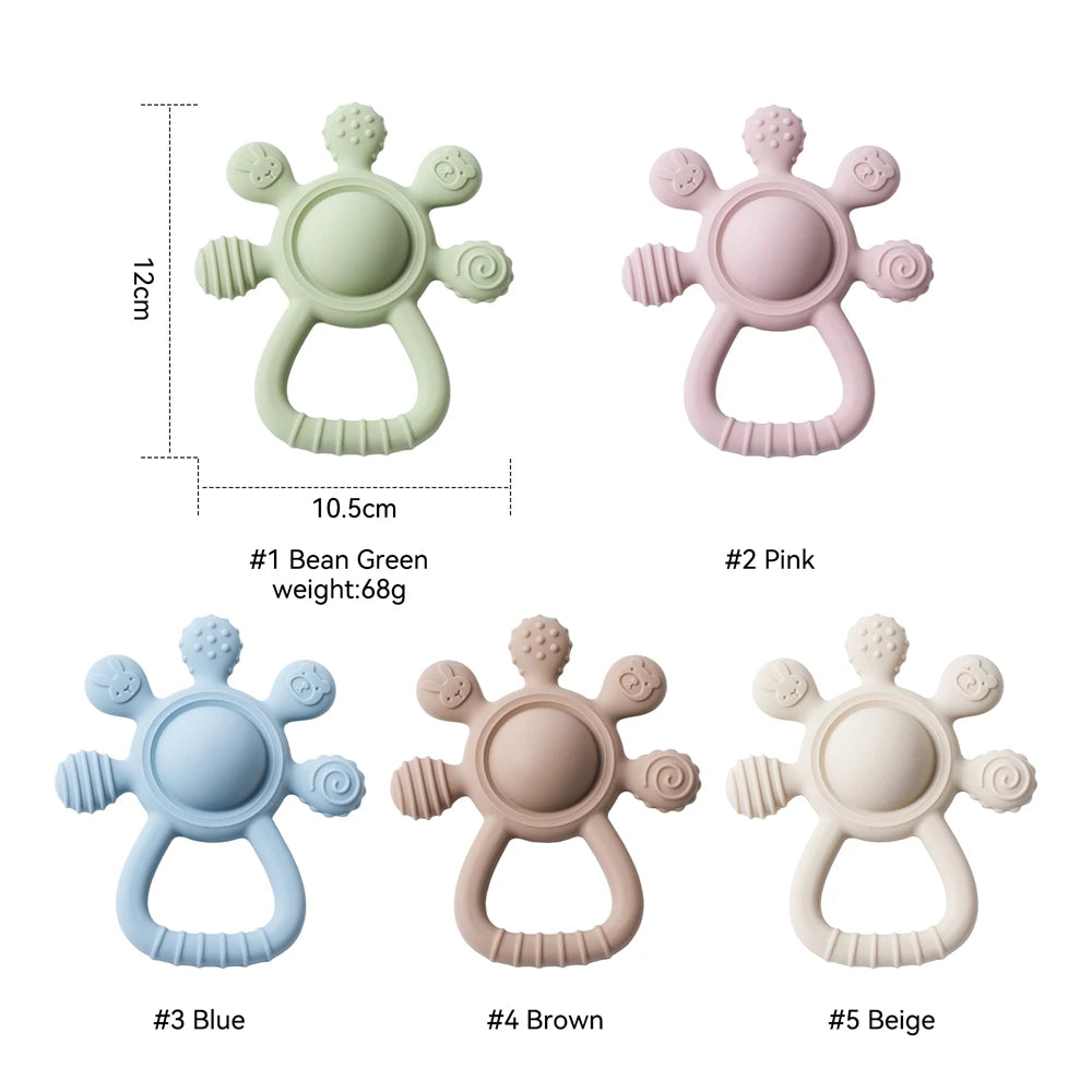Set of five silicone baby teethers in pastel green, pink, blue, brown, and beige, each with textured handles and playful shapes, shown with size measurements.