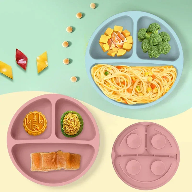 Colorful silicone baby plates with food compartments, designed for easy toddler feeding