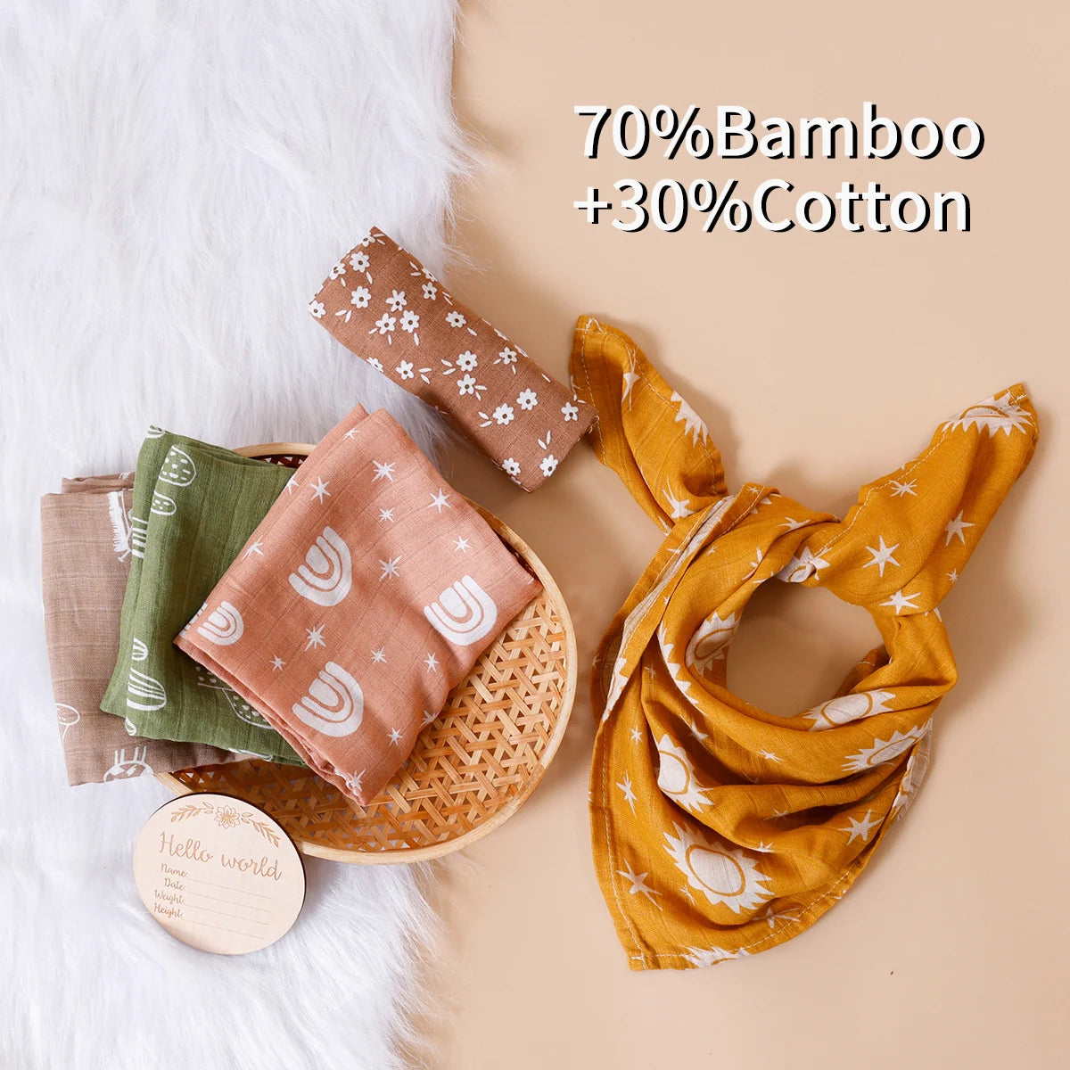 Assorted baby muslin bibs and cloths in soft colors, bamboo cotton blend, flat lay