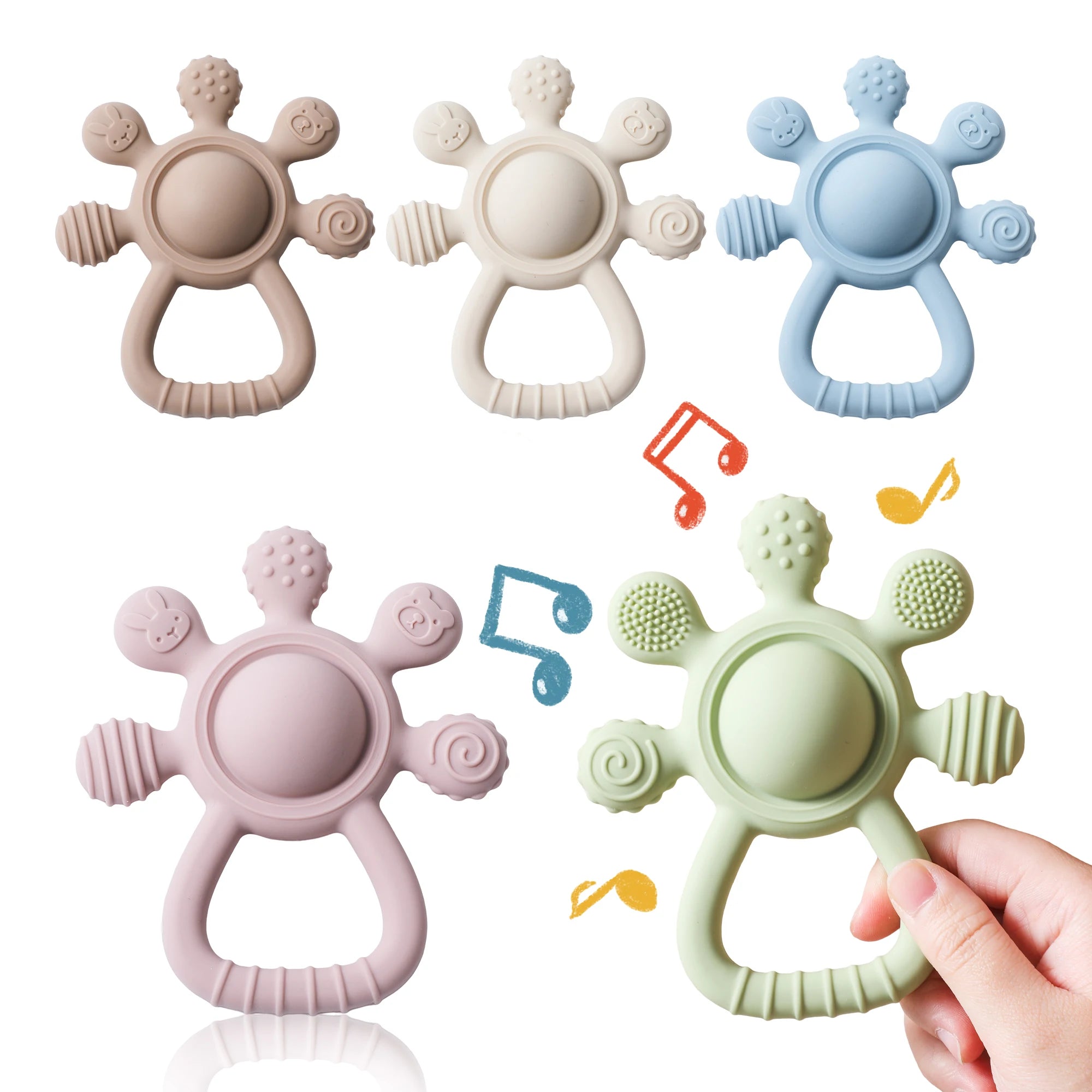Colorful silicone baby teethers with textured tips, hand holding green teether, musical notes