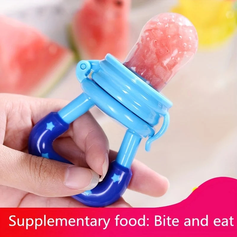 Hand holding blue baby fruit feeder pacifier with watermelon inside, close-up